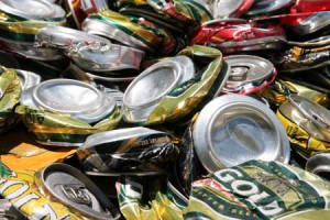 A pile of crushed aluminium drink cans ready to be recycled.