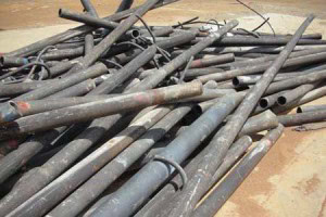 A pile of cast iron rods needing to be recycled by Tall Ingots